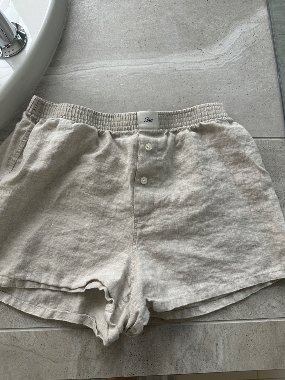 Tan linen TNA boxer style Aritzia shorts